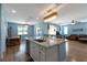 Spacious kitchen with an island, granite countertops, stainless appliances and an open floor plan at 754 Tallgrass St, Las Vegas, NV 89138