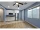 Functional kitchenette with stainless steel appliances, white cabinets and plenty of natural light at 754 Tallgrass St, Las Vegas, NV 89138