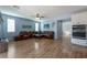 Inviting living room featuring wood floors, leather furniture and stainless steel appliances at 754 Tallgrass St, Las Vegas, NV 89138