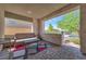 This covered patio has a comfortable seating area, perfect for relaxing or entertaining guests at 754 Tallgrass St, Las Vegas, NV 89138