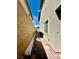 Side yard featuring modern landscaping with stone accents and decorative paver walkway at 754 Tallgrass St, Las Vegas, NV 89138