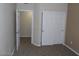 Bedroom with closet doors visible and doorway in a neutral palette at 7701 W Robindale Rd # 259, Las Vegas, NV 89113