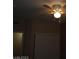 Bedroom with closet doors visible and doorway in a neutral palette and ceiling fan at 7701 W Robindale Rd # 259, Las Vegas, NV 89113