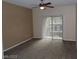 Bedroom with sliding door and neutral walls, carpet, and ceiling fan at 7701 W Robindale Rd # 259, Las Vegas, NV 89113