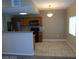 Modern kitchen featuring stainless steel appliances, warm wood cabinets, and tile flooring at 7701 W Robindale Rd # 259, Las Vegas, NV 89113