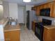 Well-equipped kitchen with stainless appliances, granite countertops, and ample cabinet space at 7701 W Robindale Rd # 259, Las Vegas, NV 89113