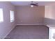 Inviting living room with neutral walls, carpeted flooring, and natural light from the windows at 7701 W Robindale Rd # 259, Las Vegas, NV 89113