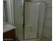 Bright bathroom featuring a corner shower with chrome door and built in seat at 7701 W Robindale Rd # 259, Las Vegas, NV 89113