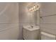 Clean bathroom with a white vanity, toilet, and modern fixtures, creating a fresh and inviting space at 7968 Lisa Dawn Ave, Las Vegas, NV 89147