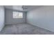 Bright bedroom with a ceiling fan and a window, offering a comfortable and private retreat at 7968 Lisa Dawn Ave, Las Vegas, NV 89147