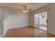 Dining area featuring hardwood floors, a ceiling fan, and sliding glass doors at 7968 Lisa Dawn Ave, Las Vegas, NV 89147