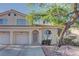 Charming two-story home with a well-manicured yard and attached two-car garage at 7968 Lisa Dawn Ave, Las Vegas, NV 89147