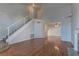 Spacious living area with a staircase, fireplace, and hardwood floors at 7968 Lisa Dawn Ave, Las Vegas, NV 89147