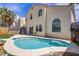 Enjoy this pool and outdoor space with lawn, flowers, and privacy wall at 8116 Kokoma Dr, Las Vegas, NV 89128