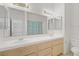 Bathroom with double sinks, a large mirror, and well-maintained fixtures, providing a functional space at 8116 Kokoma Dr, Las Vegas, NV 89128