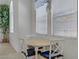 Bright dining area with large windows and seating for four, perfect for casual meals at 8116 Kokoma Dr, Las Vegas, NV 89128