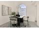 Well-lit dining room featuring modern decor, neutral colors, and a beautiful decorative chandelier at 8116 Kokoma Dr, Las Vegas, NV 89128