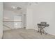 Upstairs loft area with neutral carpeting, open layout, and versatile space for various uses at 8116 Kokoma Dr, Las Vegas, NV 89128