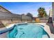Backyard pool features lovely landscaping and privacy wall at 8116 Kokoma Dr, Las Vegas, NV 89128