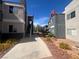Condominium building featuring desert landscaping, multiple floors, and a pathway at 8600 W Charleston Blvd # 2033, Las Vegas, NV 89117