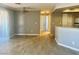 Open concept living and dining room with wood floors and natural light at 8600 W Charleston Blvd # 2033, Las Vegas, NV 89117