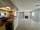 Open floor plan featuring a kitchen with stainless appliances and spacious living area with fireplace at 8600 W Charleston Blvd # 2033, Las Vegas, NV 89117