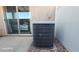 Air conditioner unit located in outdoor patio area with sliding glass door at 864 Chianti Way, Mesquite, NV 89027