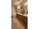 Bright bathroom featuring dual sinks, bathtub and tiled flooring at 864 Chianti Way, Mesquite, NV 89027