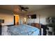 Bedroom featuring a tv, and a four poster bed, and an ensuite bathroom at 864 Chianti Way, Mesquite, NV 89027