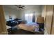Bedroom with a ceiling fan, and lots of natural light with sliding doors to the yard at 864 Chianti Way, Mesquite, NV 89027