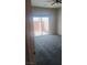 Bedroom featuring plush neutral carpet and a glass sliding door to the outside at 864 Chianti Way, Mesquite, NV 89027