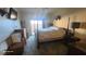 Well-lit bedroom featuring a four poster bed and sliding doors to the yard at 864 Chianti Way, Mesquite, NV 89027
