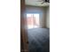 Carpeted bedroom with a sliding glass door leading to a private outdoor patio at 864 Chianti Way, Mesquite, NV 89027