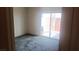 Bedroom with sliding glass door to patio and neutral carpet flooring at 864 Chianti Way, Mesquite, NV 89027
