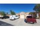 Charming single-story home showcasing a well-maintained exterior with a private two-car garage and desert landscaping at 864 Chianti Way, Mesquite, NV 89027