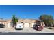 Charming single-story home showcasing a well-maintained exterior with a private two-car garage and desert landscaping at 864 Chianti Way, Mesquite, NV 89027