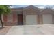Charming single-story home with stone accents, two-car garage, and well-maintained landscaping at 864 Chianti Way, Mesquite, NV 89027