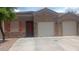 Charming single-story home with a stone facade and three-car garage at 864 Chianti Way, Mesquite, NV 89027