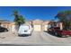 Charming single-story home showcasing a well-maintained exterior with a private two-car garage and desert landscaping at 864 Chianti Way, Mesquite, NV 89027