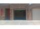 Spacious three-car garage with ample space for parking and storage with a ceiling fan at 864 Chianti Way, Mesquite, NV 89027
