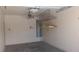 Clean and well-maintained garage interior featuring a ceiling fan, shelving and water heater at 864 Chianti Way, Mesquite, NV 89027