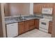 Kitchen featuring granite countertops, wooden cabinets and modern appliances at 864 Chianti Way, Mesquite, NV 89027