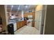 Updated kitchen with granite counters, tile flooring, and modern appliances at 864 Chianti Way, Mesquite, NV 89027