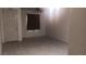 Neutral living room with tile flooring, ceiling fan, and a door to the outside at 864 Chianti Way, Mesquite, NV 89027