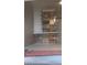 Open-concept living space showcasing tile floors, ceiling fan and partial view of the kitchen at 864 Chianti Way, Mesquite, NV 89027