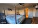 Spacious main bedroom featuring a ceiling fan and a four-poster bed at 864 Chianti Way, Mesquite, NV 89027