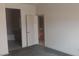 Main bedroom with ensuite bathroom entrance; neutral walls and carpet at 864 Chianti Way, Mesquite, NV 89027