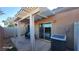 Cozy covered patio with dining set and AC unit; sliding doors offer easy access to interior at 864 Chianti Way, Mesquite, NV 89027