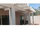 Enclosed patio with white pergola, providing shade and access to the home at 864 Chianti Way, Mesquite, NV 89027