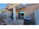 Cozy covered patio with dining set and AC unit; sliding doors offer easy access to interior at 864 Chianti Way, Mesquite, NV 89027